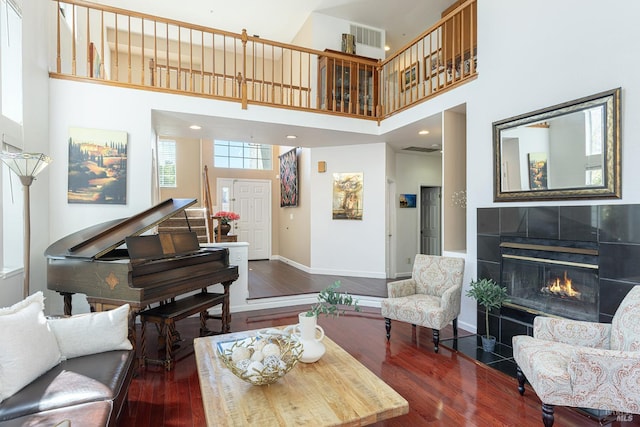 2130 Camenson St, Napa, CA 94558 - living room with a towering ceiling, wood finished floors, and a tiled fireplace