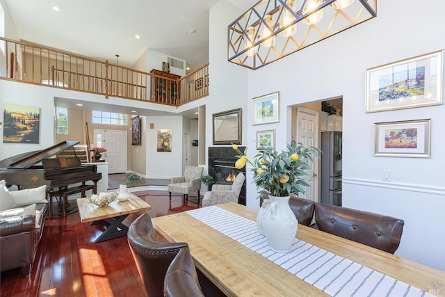 2130 Camenson St, Napa, CA 94558 - dining area with dark wood-type flooring, a towering ceiling, a fireplace, and recessed lighting