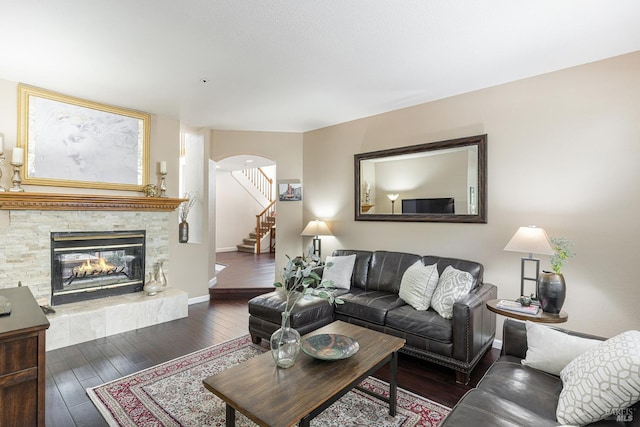 2130 Camenson St, Napa, CA 94558 - living area with wood-type flooring, stairs, arched walkways, and a tiled fireplace