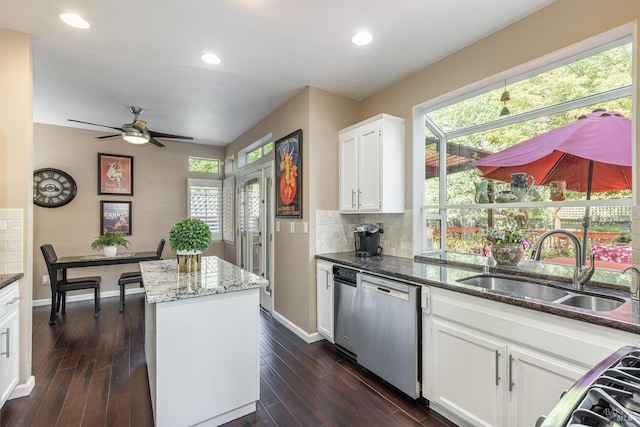 2130 Camenson St, Napa, CA 94558 - kitchen featuring stainless steel dishwasher, a center island, dark stone countertops, ceiling fan, and healthy amount of natural light