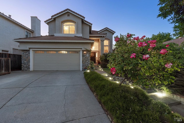 2130 Camenson St, Napa, CA 94558 - traditional home featuring driveway, stone siding, an attached garage, and stucco siding