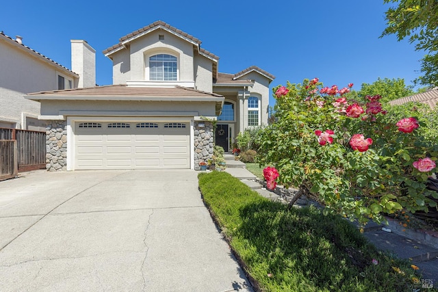 2130 Camenson St, Napa, CA 94558 - view of front of property featuring an attached garage, driveway, stucco siding, and stone siding