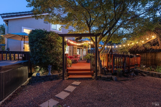 2130 Camenson St, Napa, CA 94558 - rear view of house with a hot tub, a wooden deck, and stucco siding