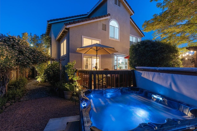 2130 Camenson St, Napa, CA 94558 - back of house with stucco siding, a deck, and a hot tub
