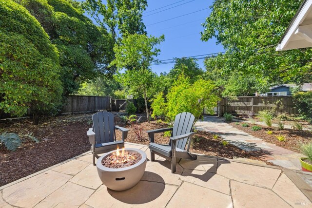 231 Railroad Ave, Woodacre, CA 94973 - view of patio featuring an outdoor fire pit and a fenced backyard