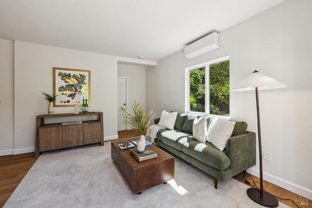 231 Railroad Ave, Woodacre, CA 94973 - living area with a wall unit AC, wood finished floors, and baseboards