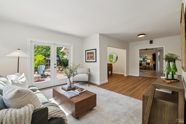 231 Railroad Ave, Woodacre, CA 94973 - living room with french doors, wood finished floors, baseboards, and a ceiling fan