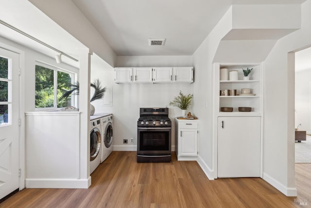 231 Railroad Ave, Woodacre, CA 94973 - clothes washing area with independent washer and dryer, light wood finished floors, and baseboards