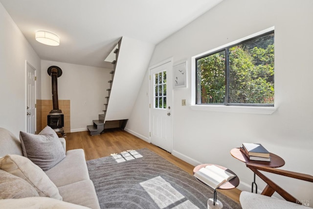 231 Railroad Ave, Woodacre, CA 94973 - living room featuring stairway, wood finished floors, a wood stove, and baseboards