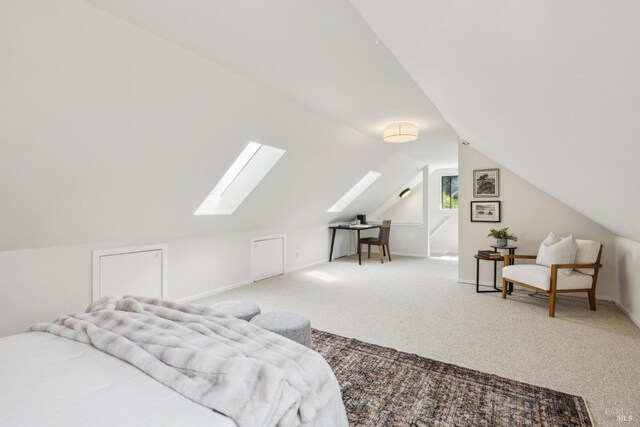 231 Railroad Ave, Woodacre, CA 94973 - carpeted bedroom with a skylight, vaulted ceiling, and baseboards