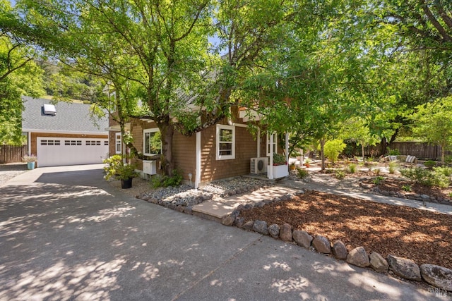 231 Railroad Ave, Woodacre, CA 94973 - obstructed view of property featuring concrete driveway, fence, and an attached garage