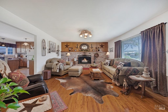 23180 Maffei Rd, Sonoma, CA 95476 - living room featuring plenty of natural light, light wood-style flooring, and a fireplace