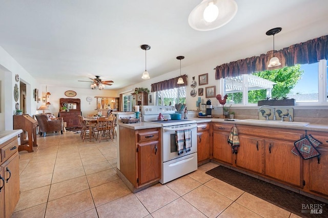 23180 Maffei Rd, Sonoma, CA 95476 - kitchen with white electric range, light countertops, and light tile patterned flooring