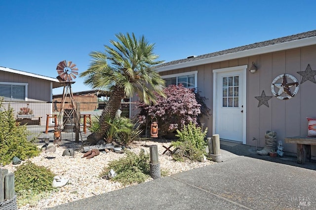 23180 Maffei Rd, Sonoma, CA 95476 - view of exterior entry with fence and board and batten siding
