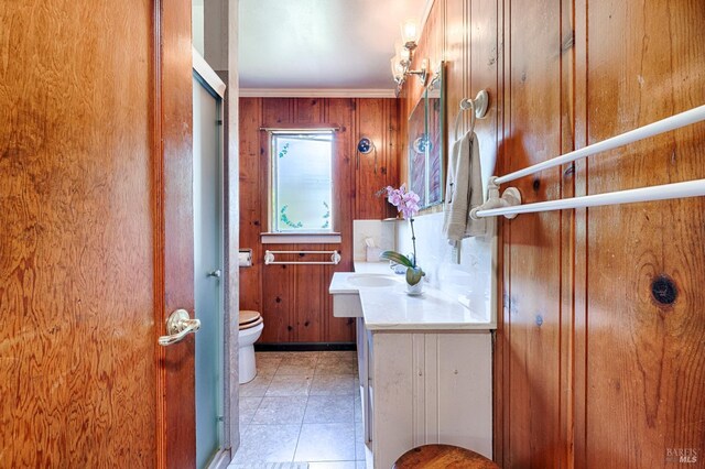 20215 Willow Rd, Monte Rio, CA 95462 - bathroom featuring toilet, wood walls, and vanity