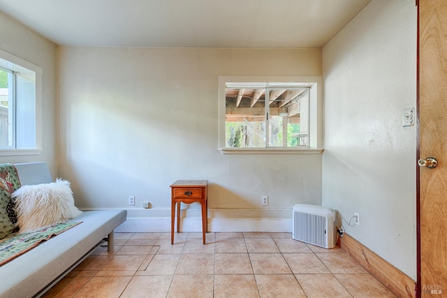 20215 Willow Rd, Monte Rio, CA 95462 - living area featuring light tile patterned floors, heating unit, and baseboards