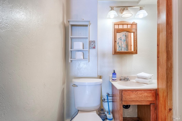 20215 Willow Rd, Monte Rio, CA 95462 - half bathroom with toilet, a textured wall, and vanity