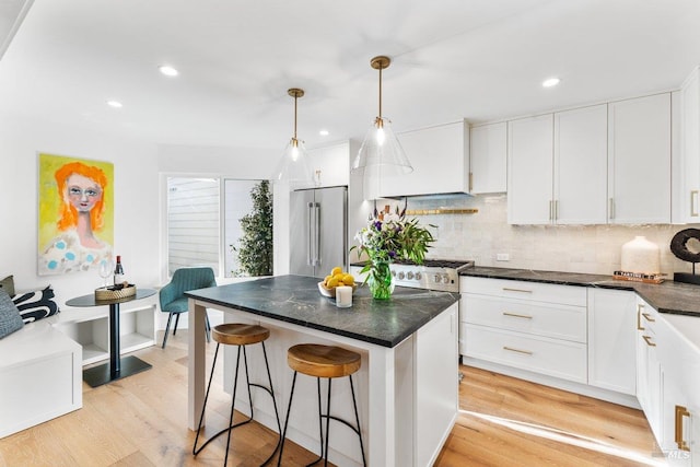1358 Sylvan Ct, Healdsburg, CA 95448 - kitchen featuring high end refrigerator, light wood finished floors, white cabinetry, and recessed lighting