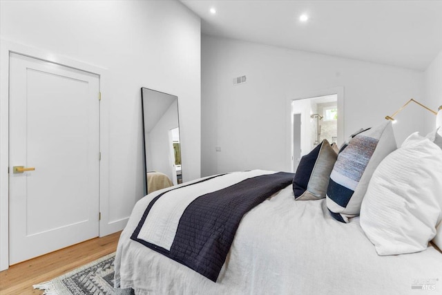 1358 Sylvan Ct, Healdsburg, CA 95448 - bedroom with vaulted ceiling, wood finished floors, recessed lighting, and ensuite bath