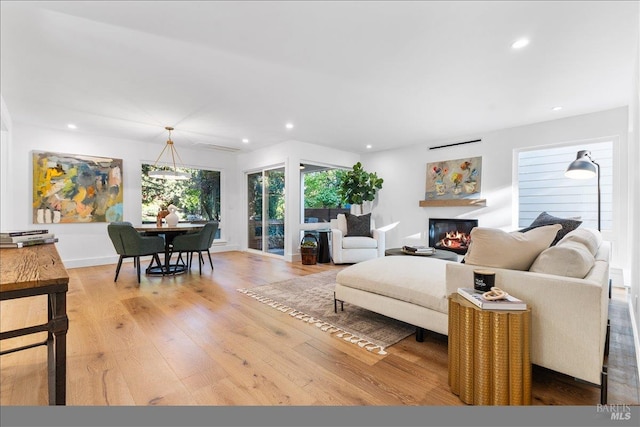 1358 Sylvan Ct, Healdsburg, CA 95448 - living room with light wood-type flooring, recessed lighting, a glass covered fireplace, and baseboards