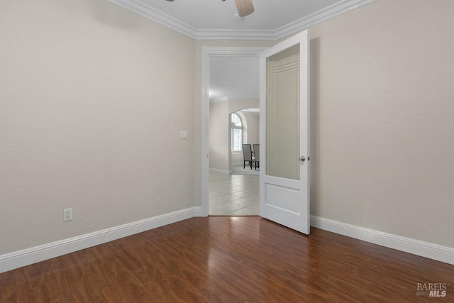 3704 Chapparal Ct, Fairfield, CA 94534 - spare room with arched walkways, ornamental molding, baseboards, a ceiling fan, and wood finished floors