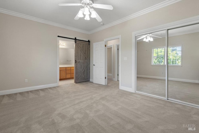 3704 Chapparal Ct, Fairfield, CA 94534 - unfurnished bedroom featuring ornamental molding, a barn door, a closet, light carpet, and baseboards