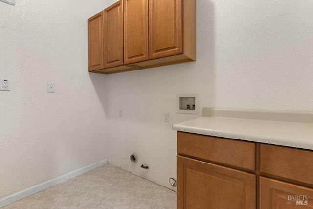3704 Chapparal Ct, Fairfield, CA 94534 - laundry area with gas dryer hookup, cabinet space, hookup for a washing machine, baseboards, and light tile patterned floors