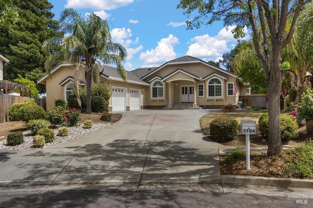 3704 Chapparal Ct, Fairfield, CA 94534 - ranch-style house featuring a garage, stucco siding, concrete driveway, fence, and a tile roof