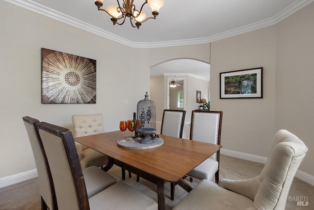 3704 Chapparal Ct, Fairfield, CA 94534 - dining space featuring arched walkways, a chandelier, carpet, crown molding, and baseboards