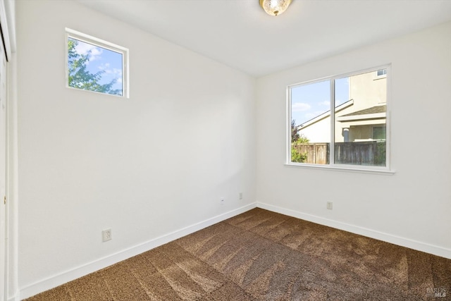 5151 Freitas Pl, Fairfield, CA 94533 - spare room with dark colored carpet and baseboards