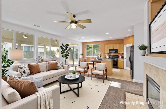 5151 Freitas Pl, Fairfield, CA 94533 - living area with ceiling fan, light carpet, a fireplace, and recessed lighting