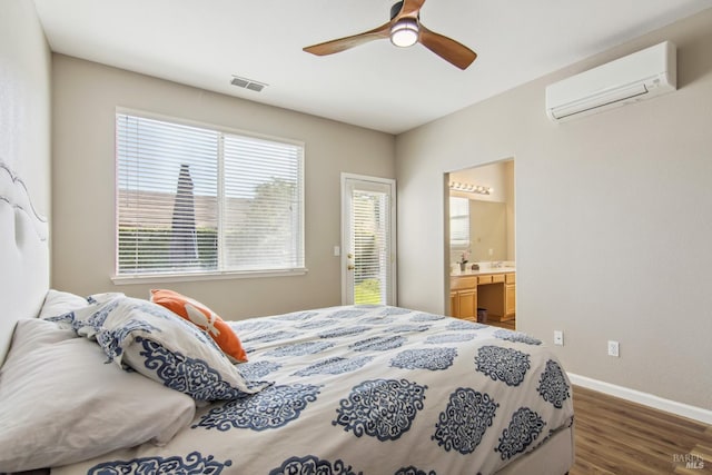 670 Turnberry Ter, Rio Vista, CA 94571 - bedroom featuring a wall unit AC, baseboards, wood finished floors, a ceiling fan, and ensuite bathroom