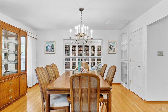607 Tobin Dr, Vallejo, CA 94589 - dining room featuring a chandelier, light wood-style floors, and baseboards