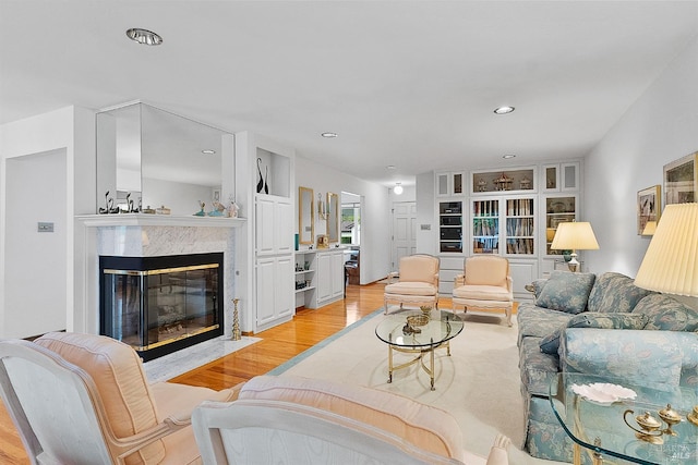 607 Tobin Dr, Vallejo, CA 94589 - living area with light wood-style floors, a high end fireplace, and recessed lighting