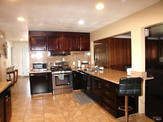 1994 Cardinal Way, Fairfield, CA 94533 - kitchen with appliances with stainless steel finishes, a sink, under cabinet range hood, backsplash, and a peninsula