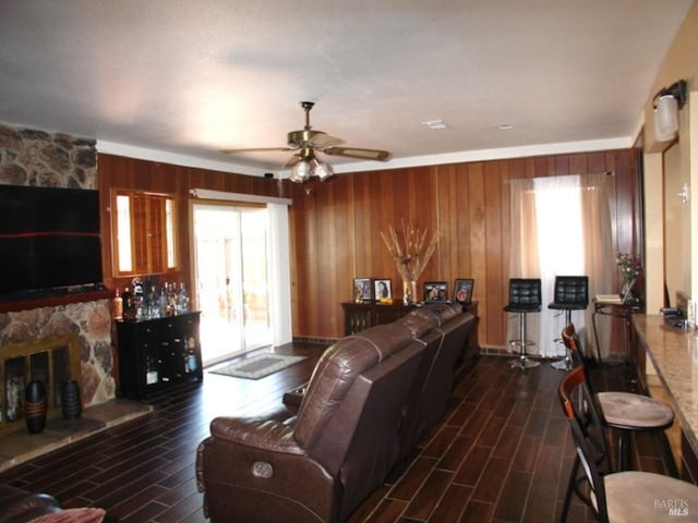 1994 Cardinal Way, Fairfield, CA 94533 - living area with dark wood-style flooring, a ceiling fan, plenty of natural light, and wooden walls