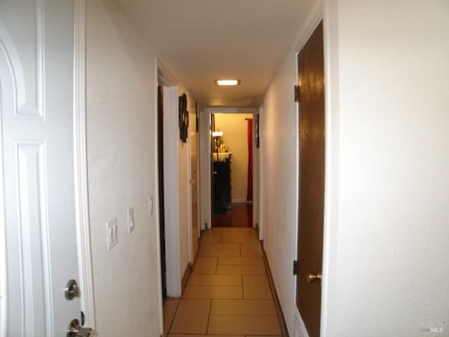 1994 Cardinal Way, Fairfield, CA 94533 - corridor featuring light tile patterned floors and baseboards