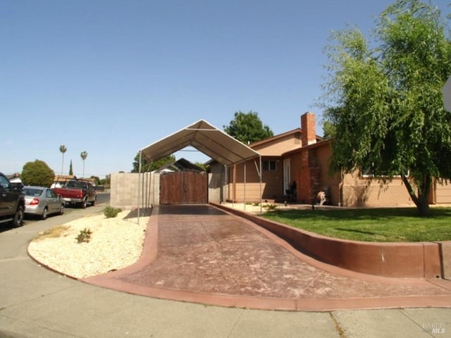 1994 Cardinal Way, Fairfield, CA 94533 - view of front of house with a detached carport, driveway, and a gate