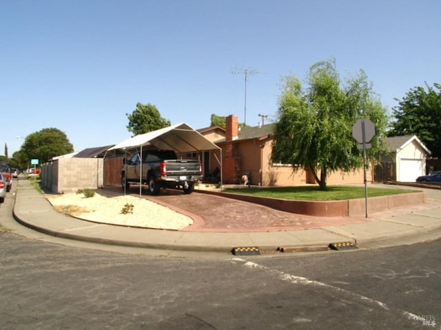 1994 Cardinal Way, Fairfield, CA 94533 - ranch-style house featuring a detached carport, asphalt driveway, and a chimney