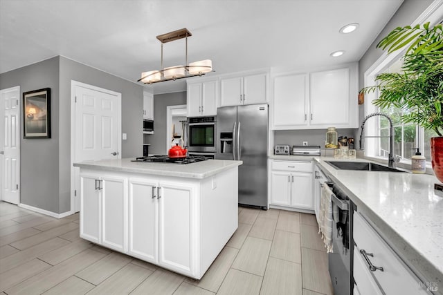 3371 Crystal Ct, Napa, CA 94558 - kitchen featuring appliances with stainless steel finishes, a sink, white cabinetry, a center island, and recessed lighting