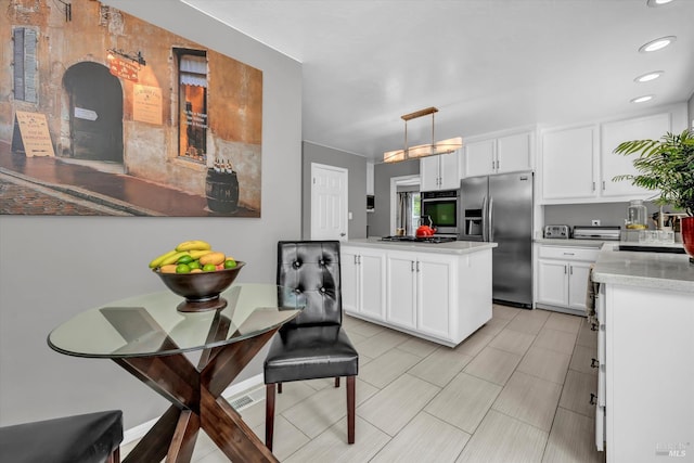 3371 Crystal Ct, Napa, CA 94558 - kitchen with stainless steel appliances, white cabinetry, light countertops, recessed lighting, and decorative light fixtures