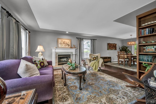 3371 Crystal Ct, Napa, CA 94558 - living area with a chandelier, a glass covered fireplace, wood finished floors, baseboards, and recessed lighting