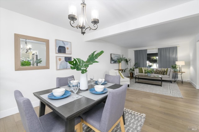 4078 Tokay Dr, Napa, CA 94558 - dining space featuring a chandelier, light wood-style floors, and baseboards