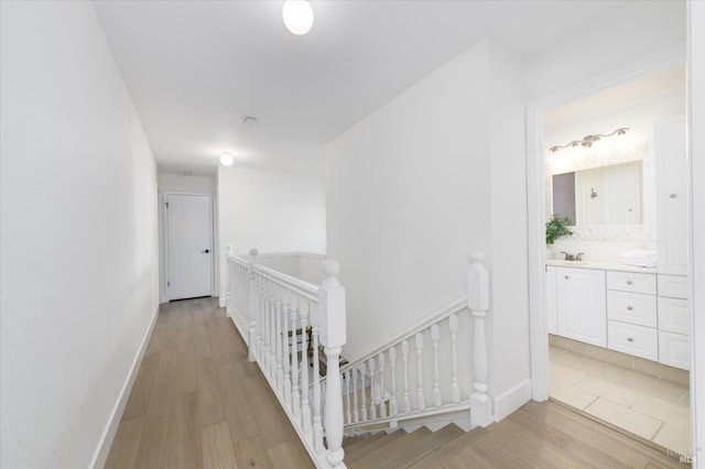 4078 Tokay Dr, Napa, CA 94558 - hall with an upstairs landing, wood finished floors, a sink, and baseboards