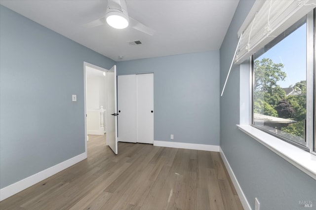 4078 Tokay Dr, Napa, CA 94558 - unfurnished bedroom featuring baseboards, wood finished floors, a closet, and ceiling fan