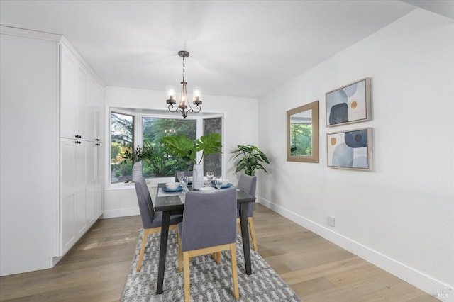 4078 Tokay Dr, Napa, CA 94558 - dining area with a chandelier, baseboards, and light wood-style floors