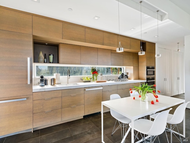 8909 Mill Creek Rd, Healdsburg, CA 95448 - kitchen with stainless steel appliances, a sink, modern cabinets, a kitchen breakfast bar, and light countertops