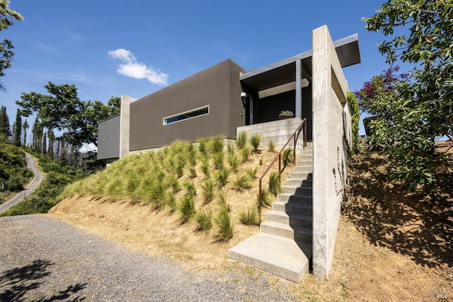 8909 Mill Creek Rd, Healdsburg, CA 95448 - view of side of home featuring stairs