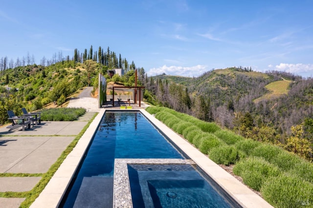 8909 Mill Creek Rd, Healdsburg, CA 95448 - outdoor pool featuring a patio area, a pergola, an in-ground hot tub, and a mountain view