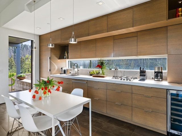 8909 Mill Creek Rd, Healdsburg, CA 95448 - kitchen featuring beverage cooler, modern cabinets, a sink, and light countertops